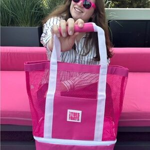 Hot pink mesh tote bag with white straps